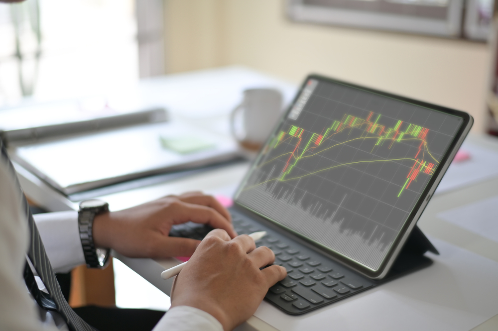CroppedShotOfPhotoBusinessManReadingAReportFinance Forex Tools Trader Impresamarkets trading instruments